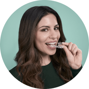 Woman removing aligner bubble